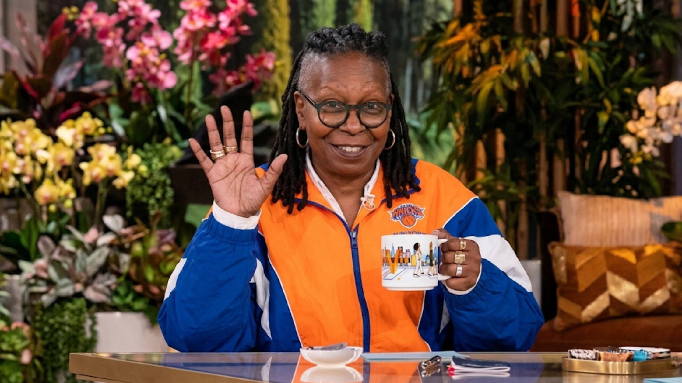 Whoopi Goldberg New York Knicks colorblock jacket from The View with orange blue chevron stripes and oversized retro streetwear fit