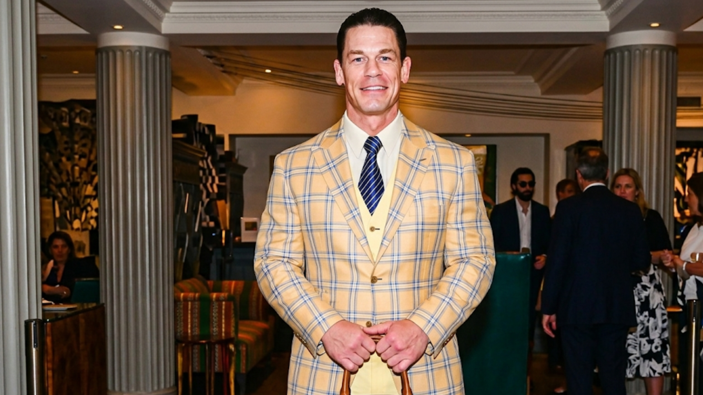John Cena Netflix Little Brother 2026 premiere yellow plaid blazer with blue windowpane pattern and three-piece formal suit styling